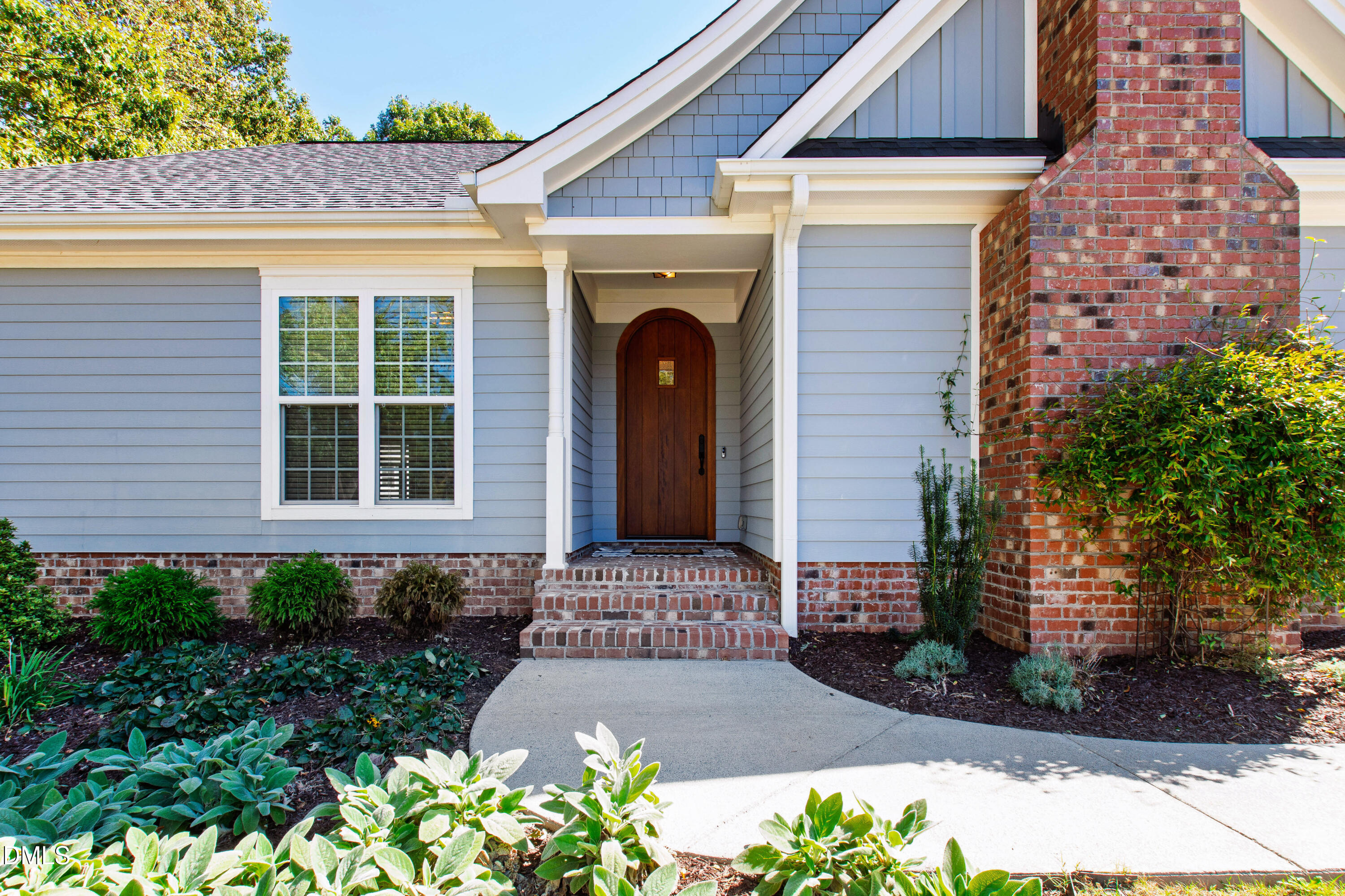 5505 Spring Road Raleigh, NC 27603 - Photo 7 of 41 a front view of a house with a yard