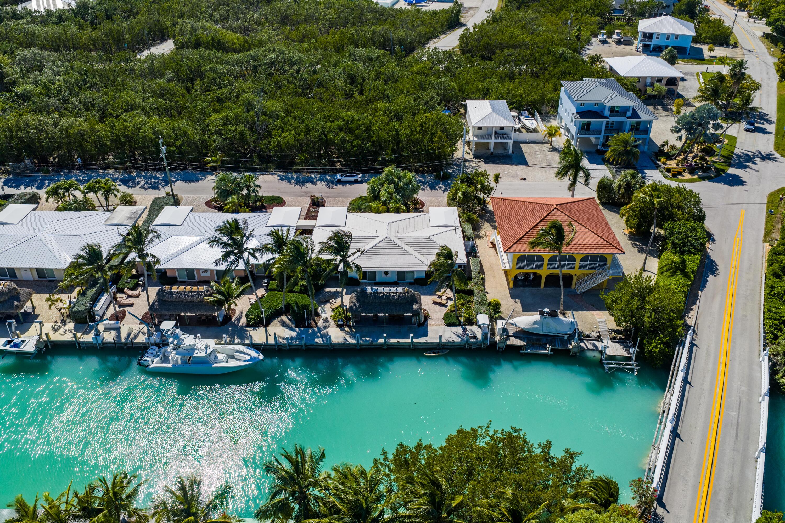 116 Indies Drive North Marathon, FL 33050 - Photo 14 of 67 an aerial view of a house with a garden and lake view