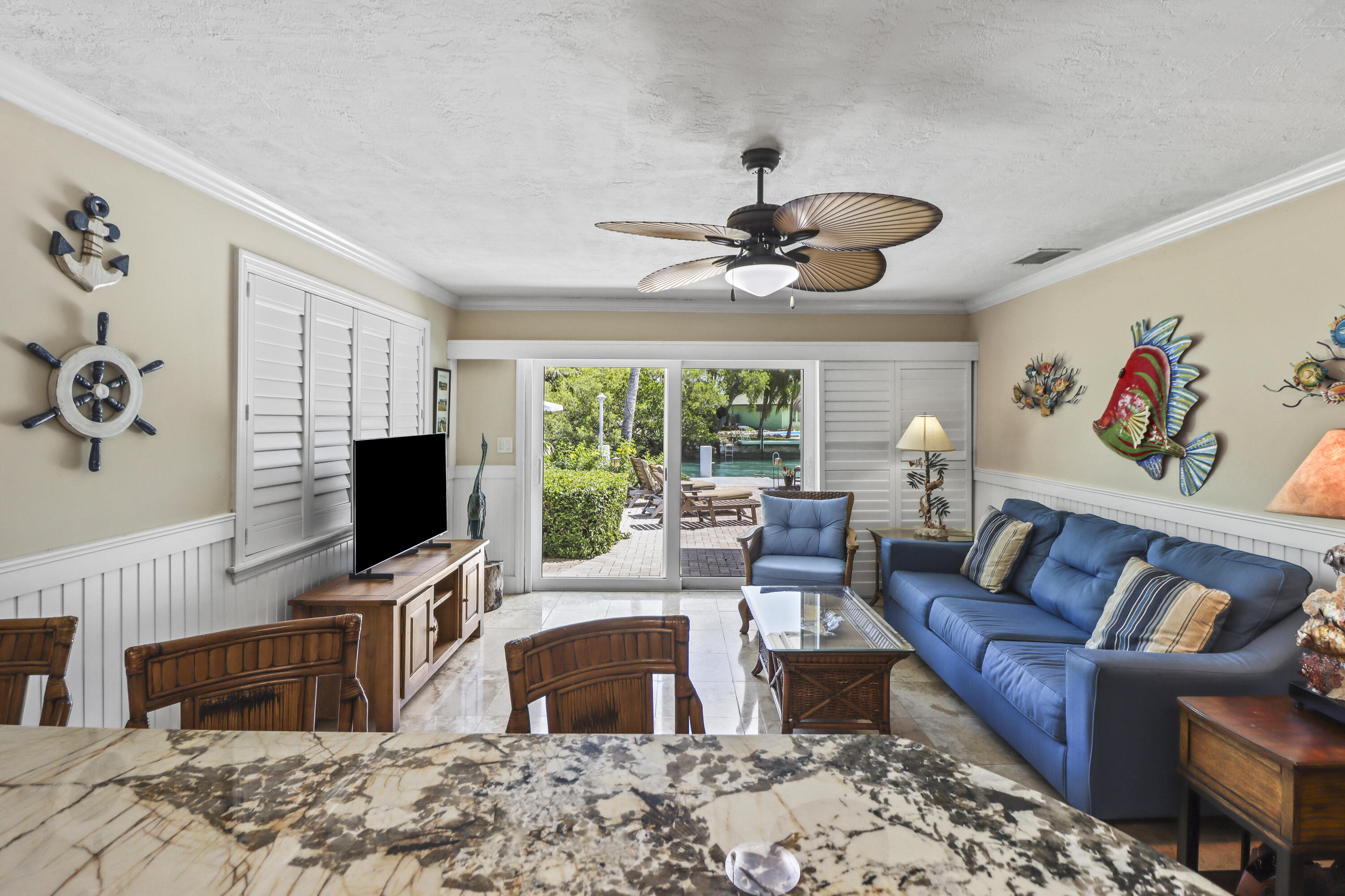 116 Indies Drive North Marathon, FL 33050 - Photo 16 of 67 a living room with furniture a fireplace and a flat screen tv