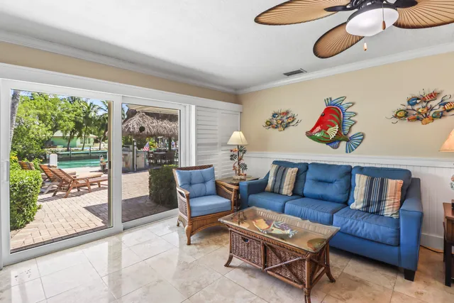 a view of a dining room with furniture and a chandelier