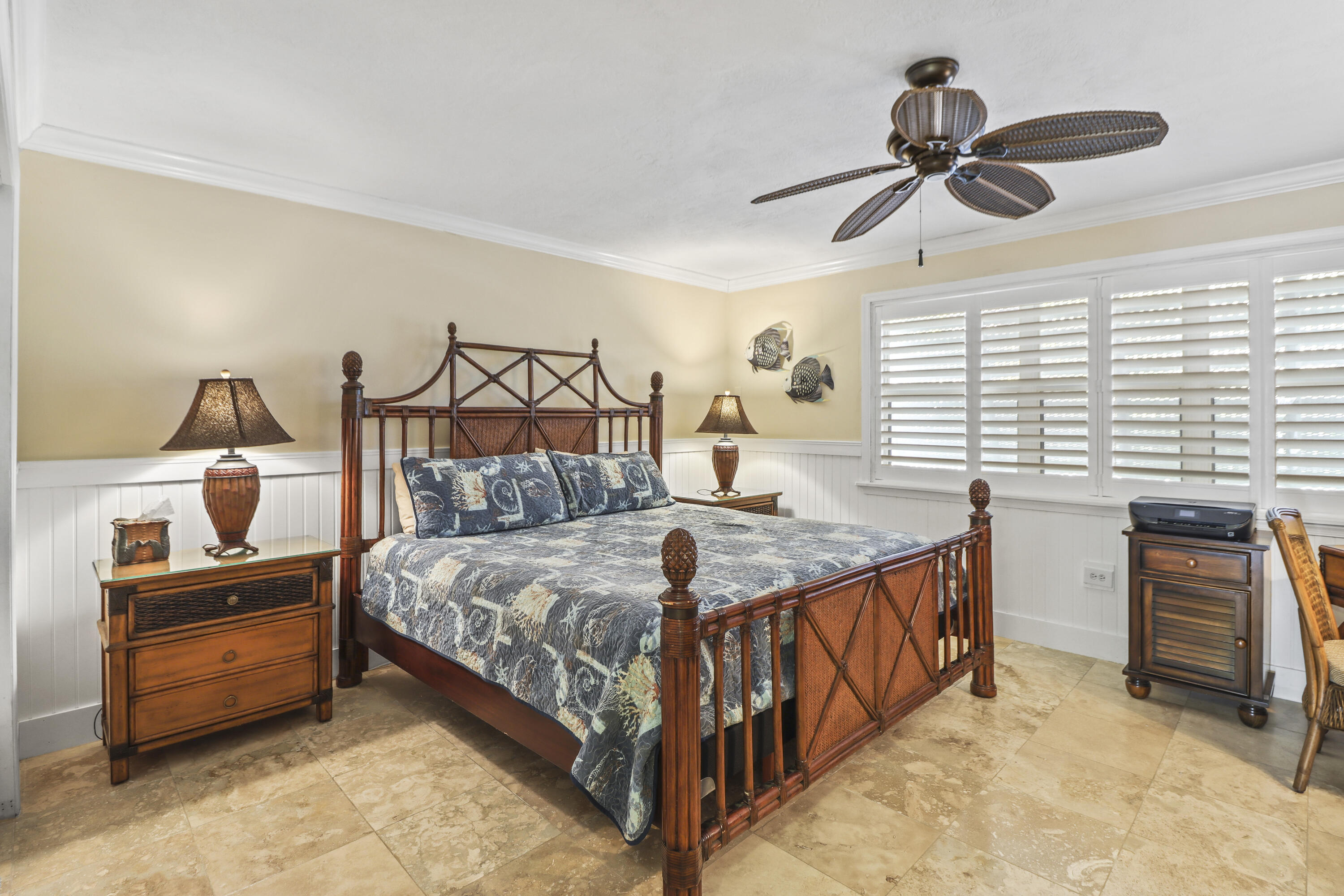 116 Indies Drive North Marathon, FL 33050 - Photo 19 of 67 a bedroom with a bed and a chandelier