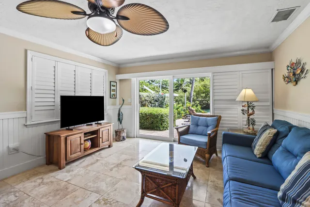 a kitchen with granite countertop a sink stove and cabinets