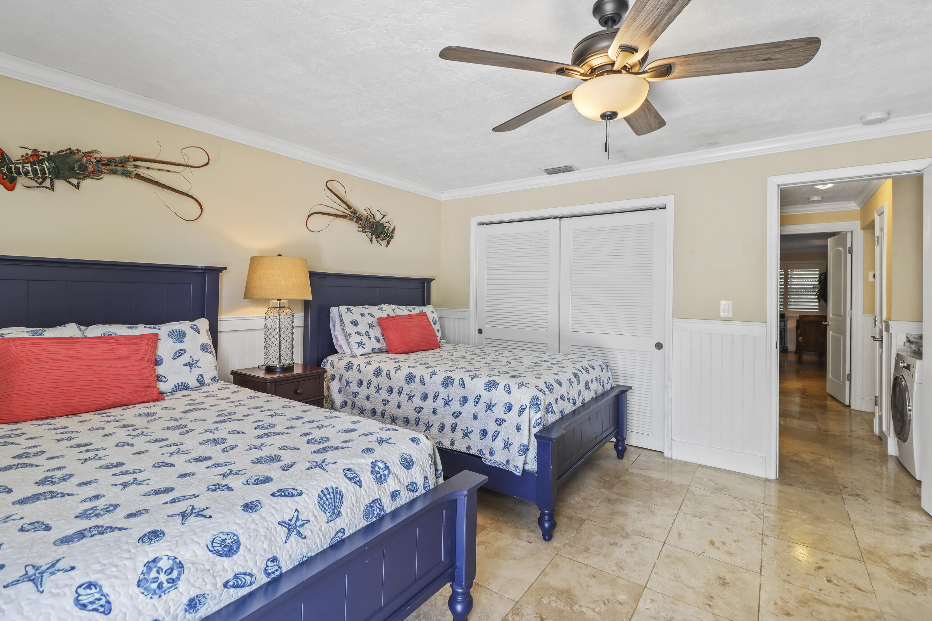 116 Indies Drive North Marathon, FL 33050 - Photo 20 of 67 a bedroom with two beds and ceiling fan