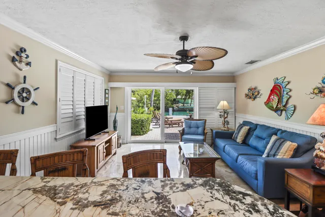 a bed room with a bed and a chandelier