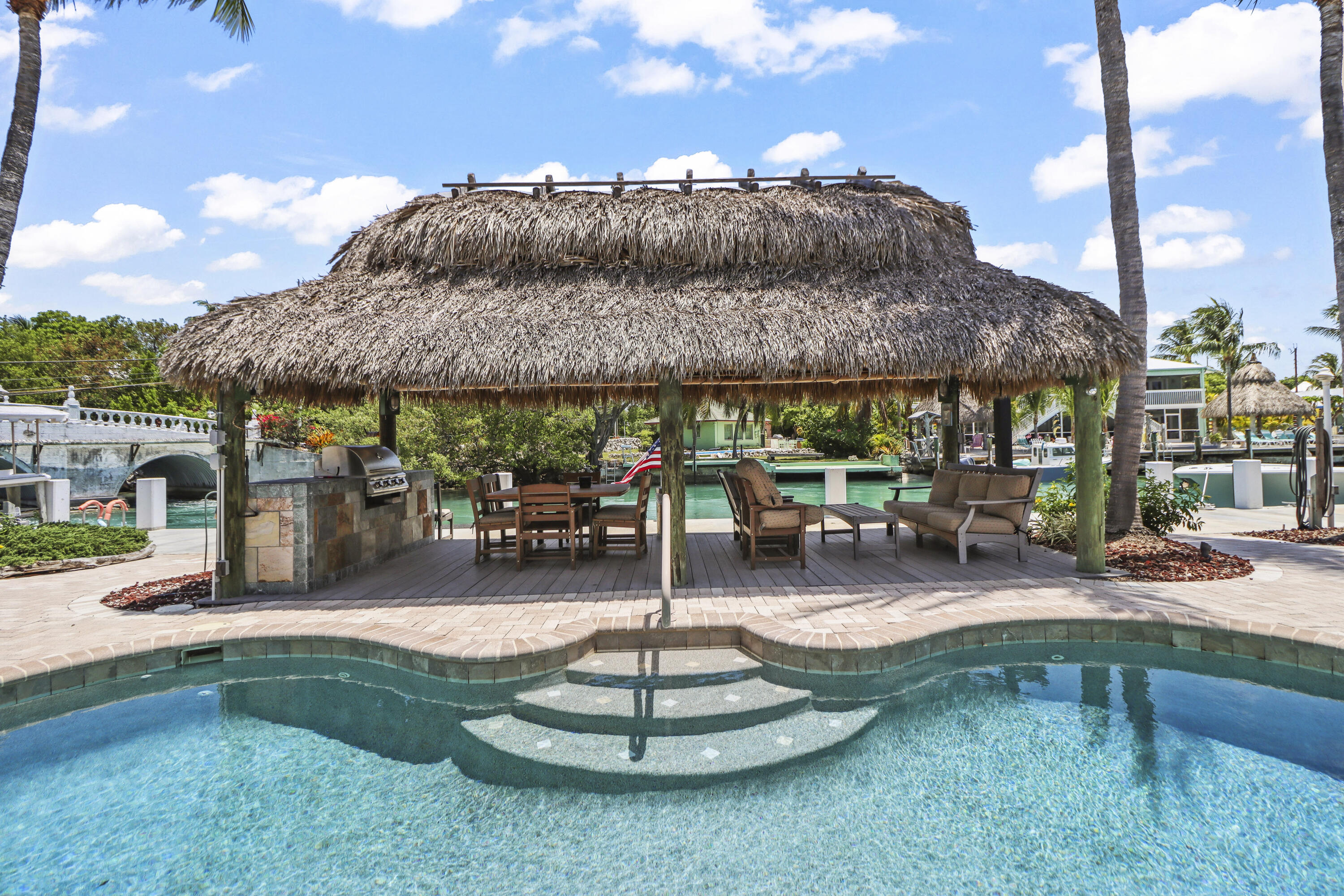 116 Indies Drive North Marathon, FL 33050 - Photo 24 of 67 a patio with a table and chairs