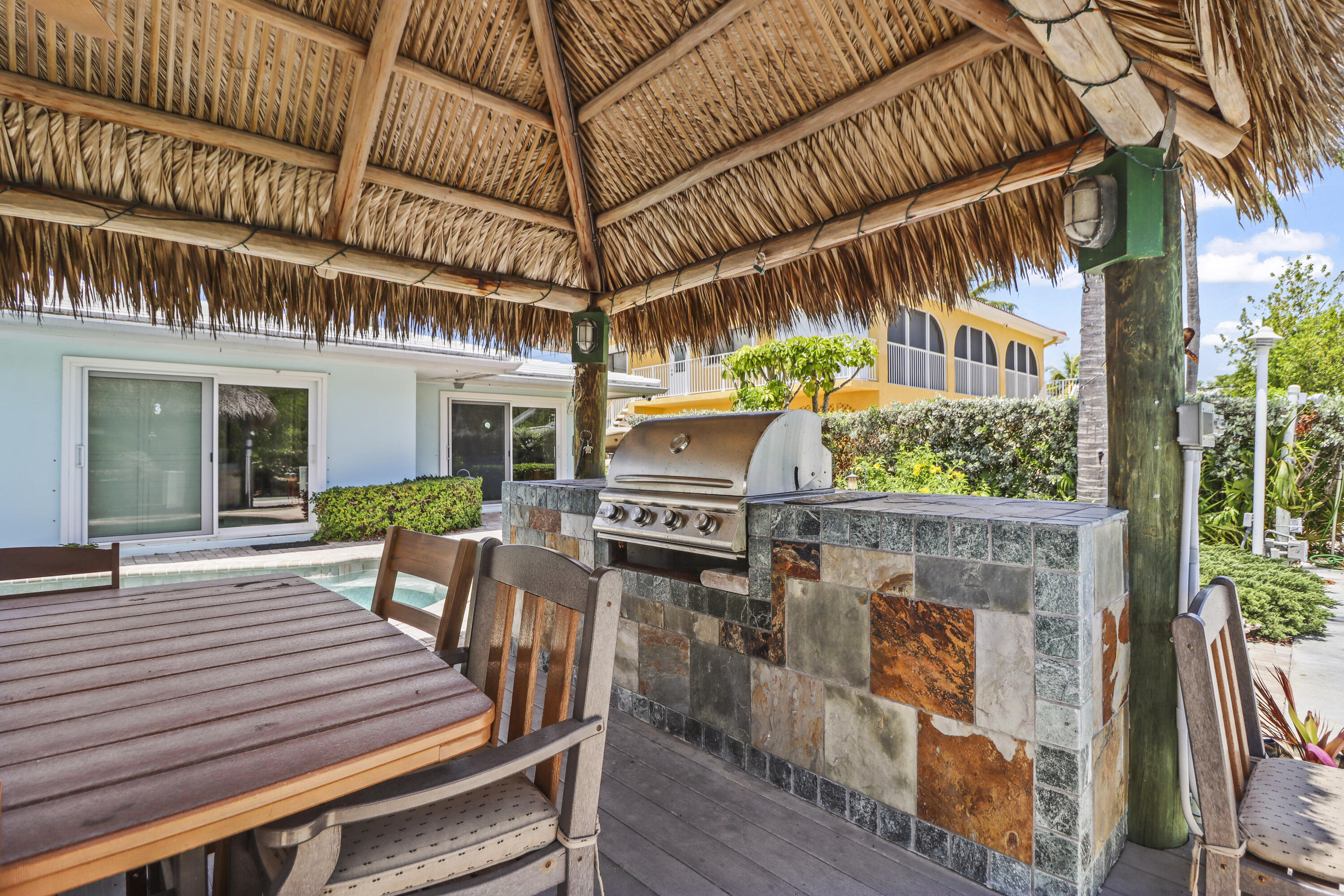 116 Indies Drive North Marathon, FL 33050 - Photo 25 of 67 a view of a chairs and table in the patio