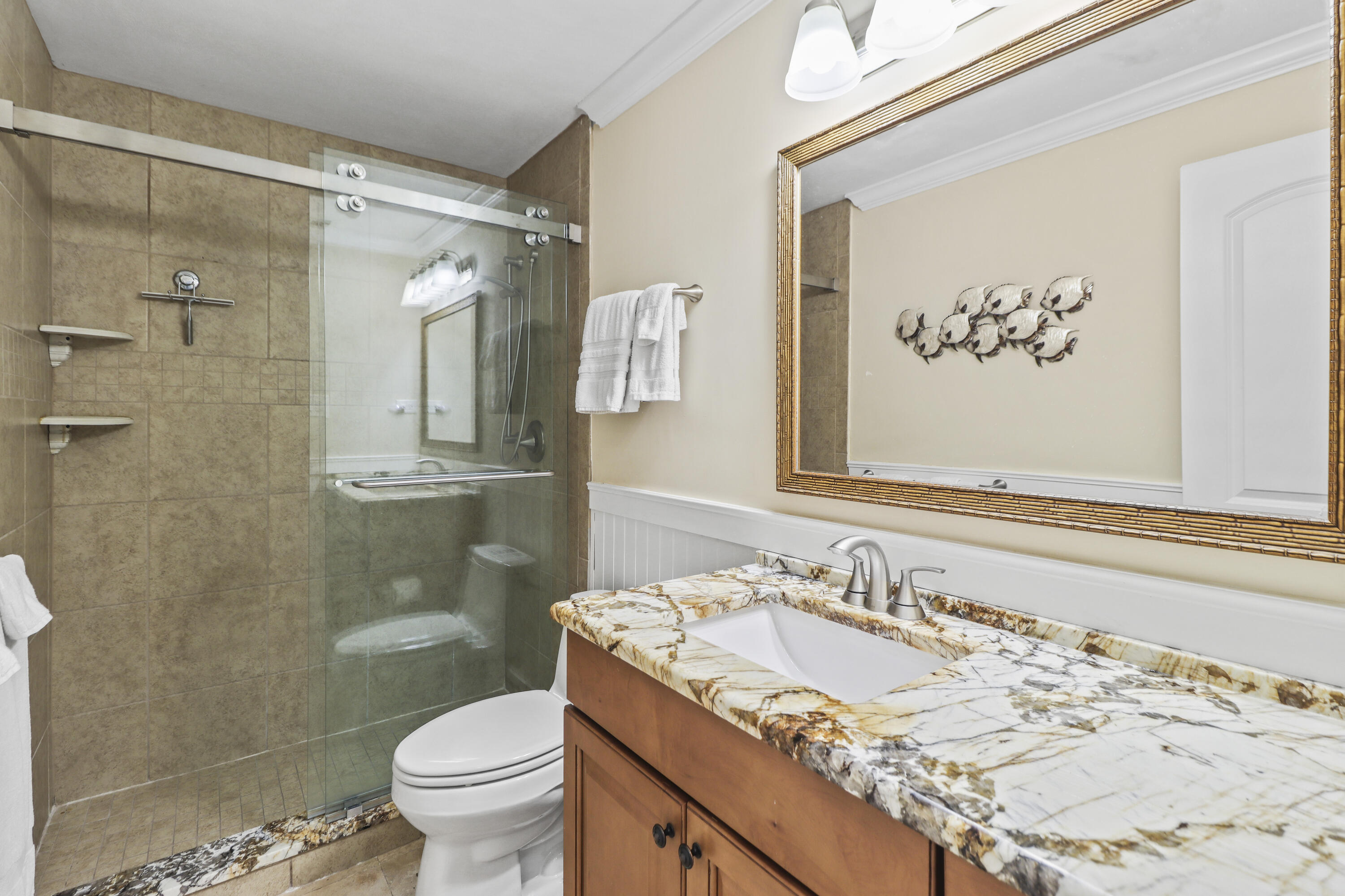 116 Indies Drive North Marathon, FL 33050 - Photo 26 of 67 a bathroom with a sink and a mirror