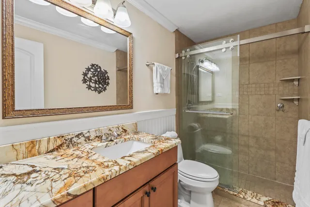 a bedroom with two beds and a large window