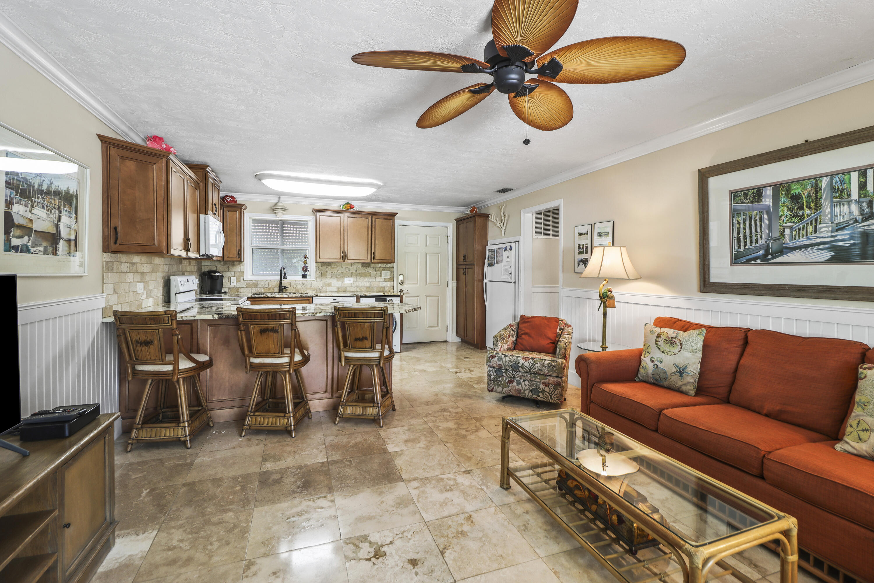 116 Indies Drive North Marathon, FL 33050 - Photo 34 of 67 a living room with furniture kitchen view and a chandelier
