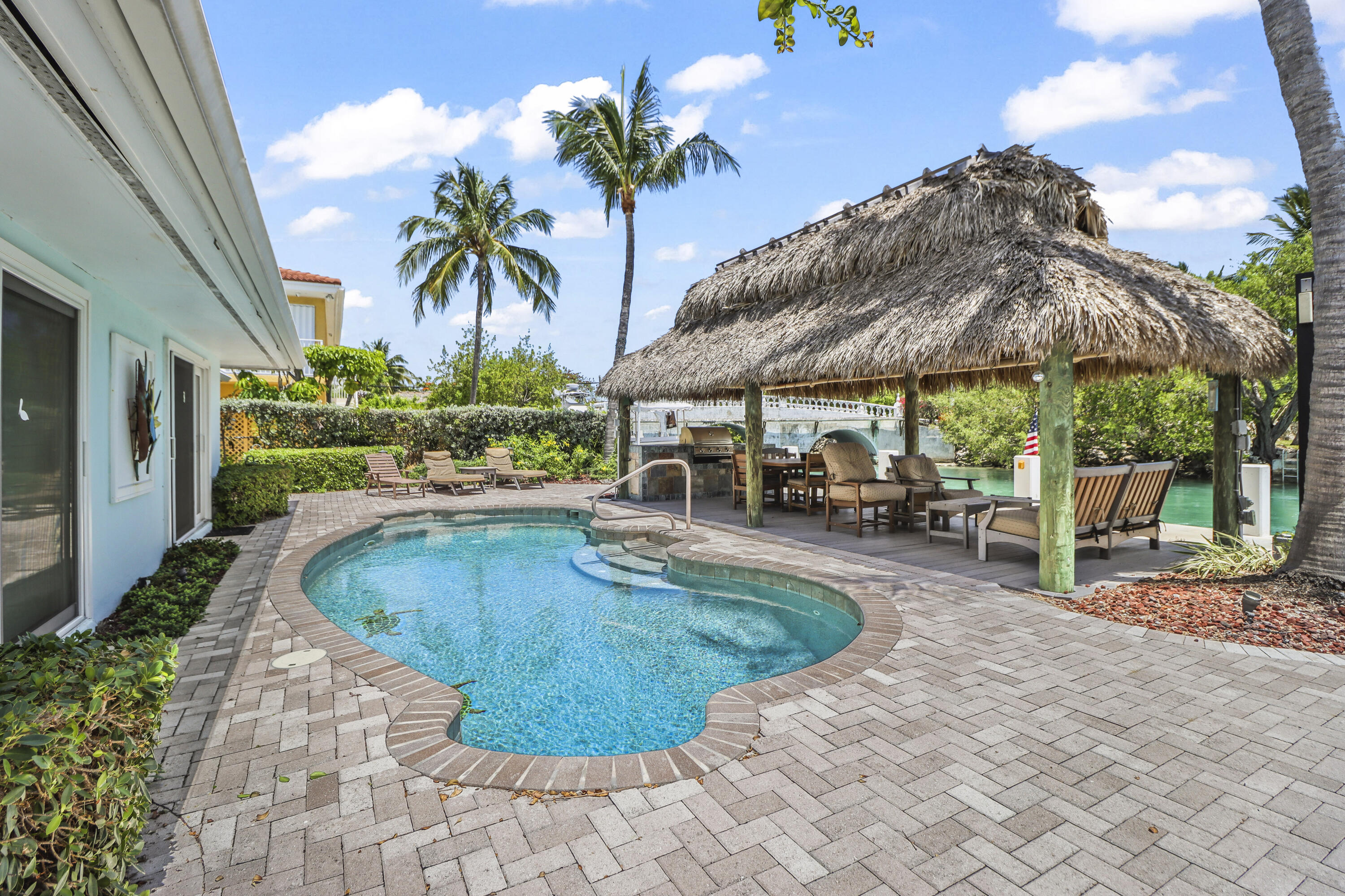 116 Indies Drive North Marathon, FL 33050 - Photo 38 of 67 a swimming pool with outdoor seating yard and barbeque oven