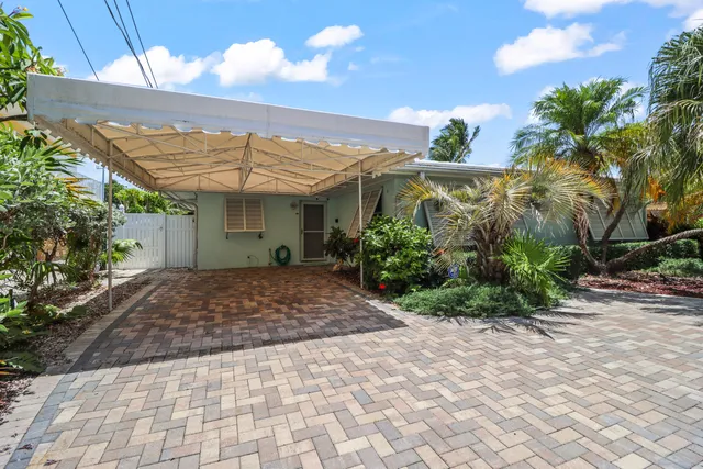 a swimming pool with outdoor seating and yard