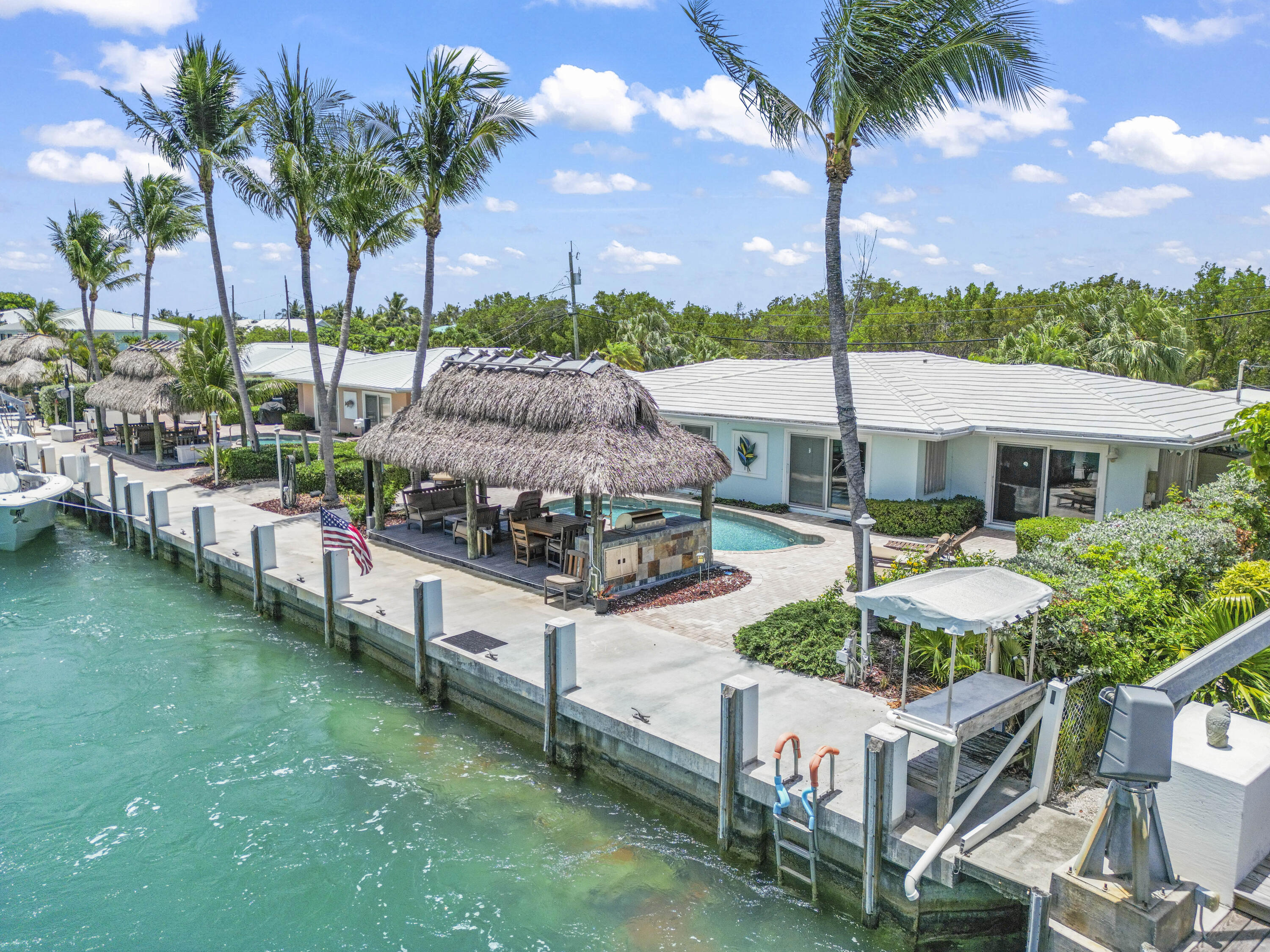 116 Indies Drive North Marathon, FL 33050 - Photo 61 of 67 a front view of a house with a garden and patio