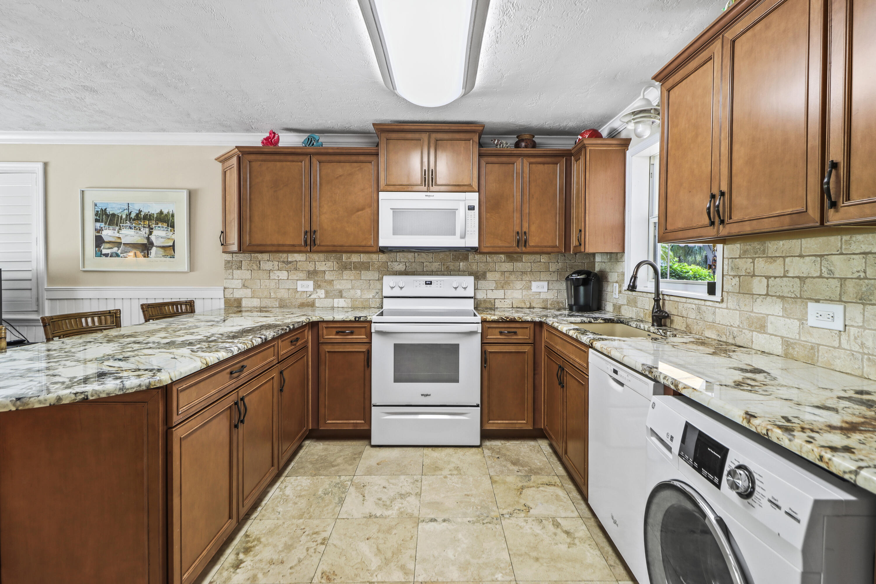 116 Indies Drive North Marathon, FL 33050 - Photo 9 of 67 a kitchen with a stove sink and cabinets