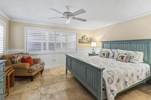 a bedroom with two beds and a couch