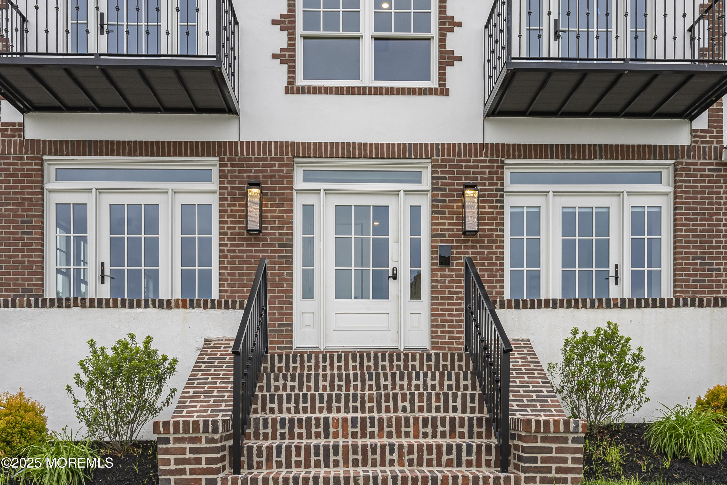 205 Edgemont Drive, Unit 1 Allenhurst, NJ 07711 - Photo 3 of 21 a view of a house with a small deck