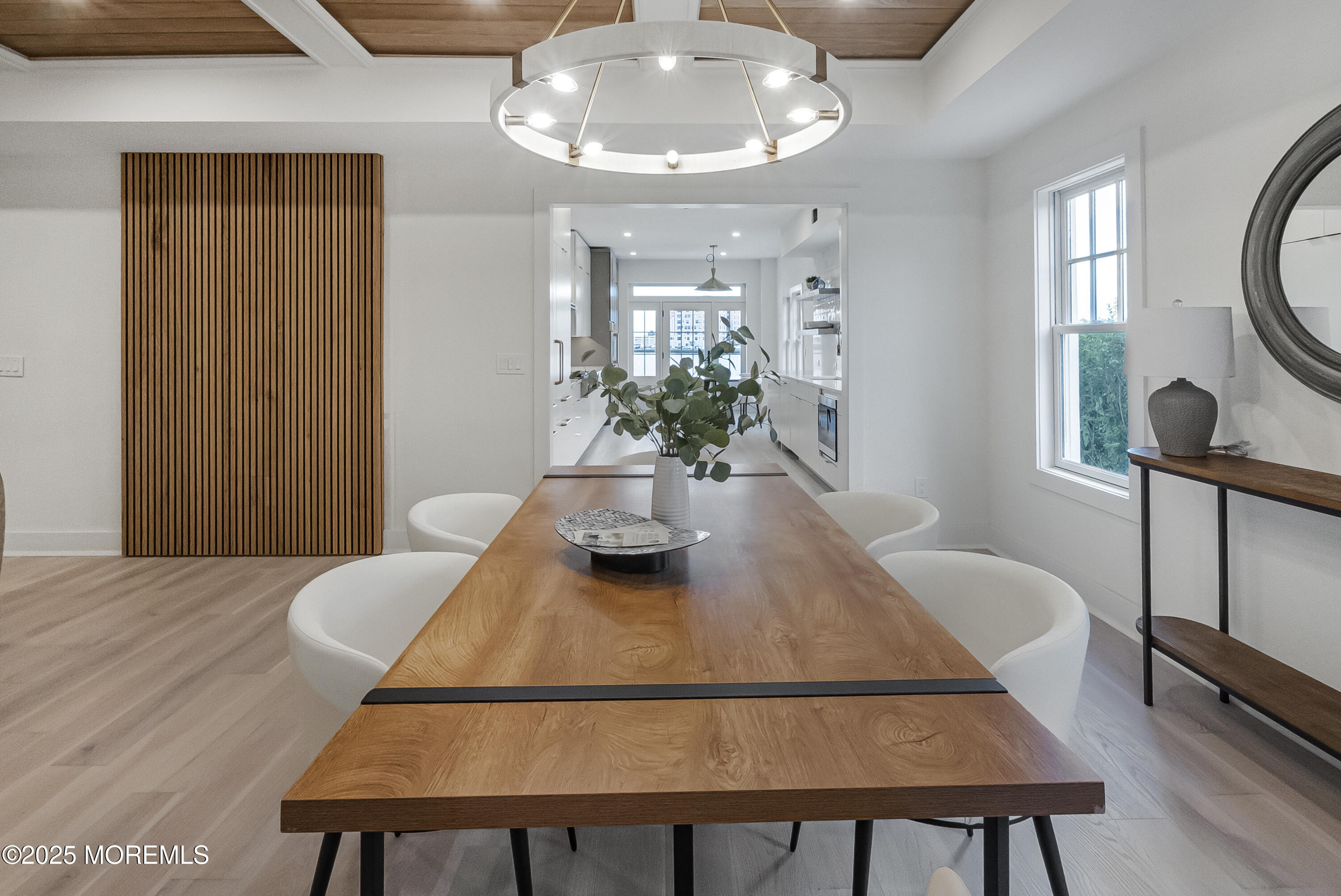 205 Edgemont Drive, Unit 1 Allenhurst, NJ 07711 - Photo 8 of 21 a view of a dining room with furniture and a chandelier