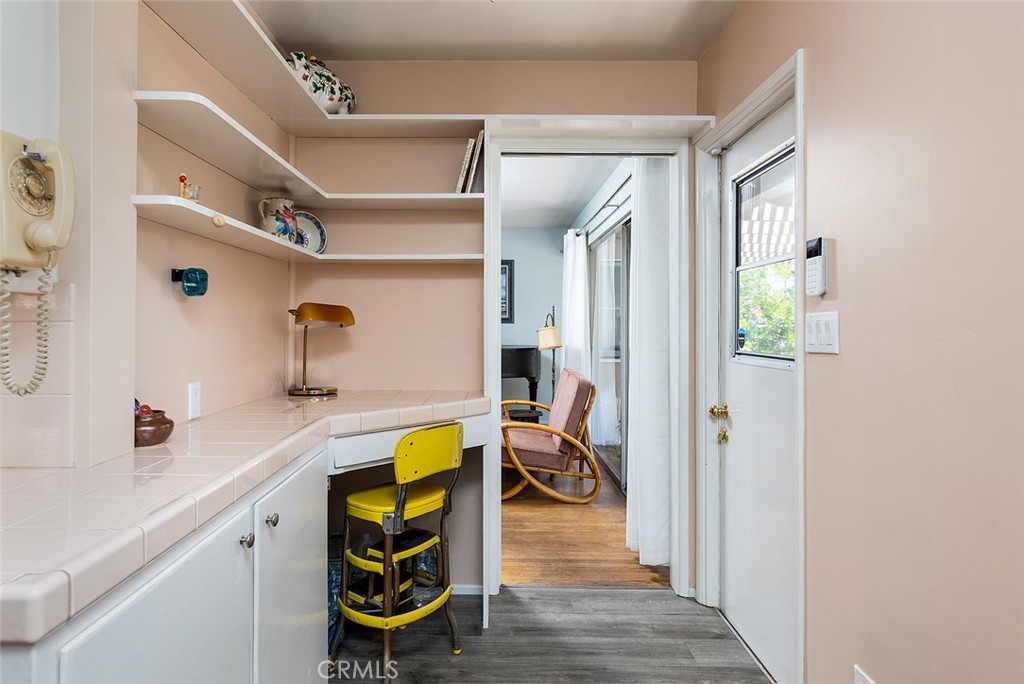 3280 Orlando Road Pasadena, CA 91107 - Photo 15 of 26 a view of a bedroom with wooden floor and furniture