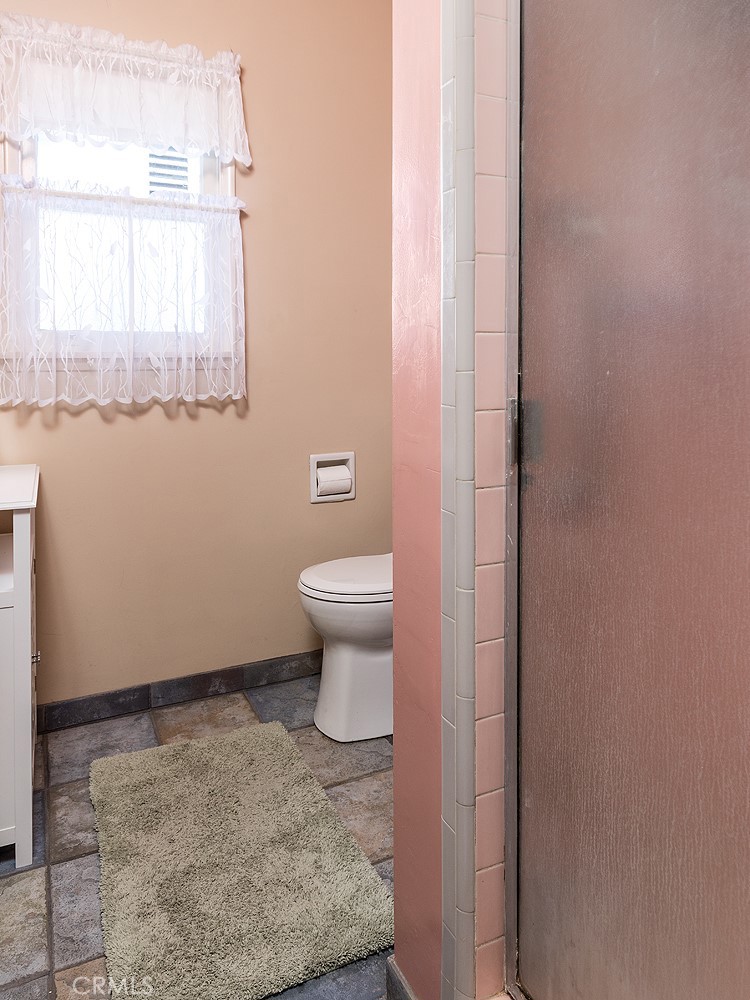 3280 Orlando Road Pasadena, CA 91107 - Photo 17 of 26 a bathroom with a toilet sink and window