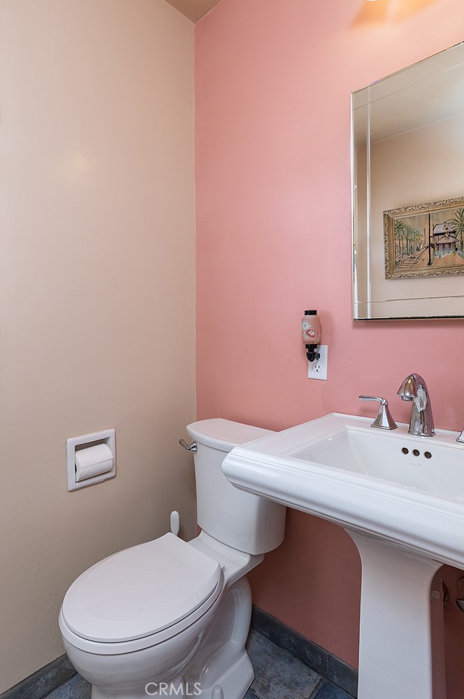 3280 Orlando Road Pasadena, CA 91107 - Photo 18 of 26 a bathroom with a sink a toilet and mirror