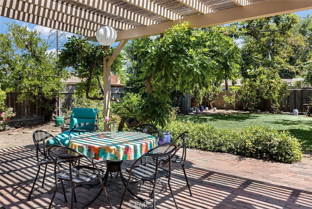 3280 Orlando Road Pasadena, CA 91107 - Photo 23 of 26 a view of a patio with table and chairs and potted plants