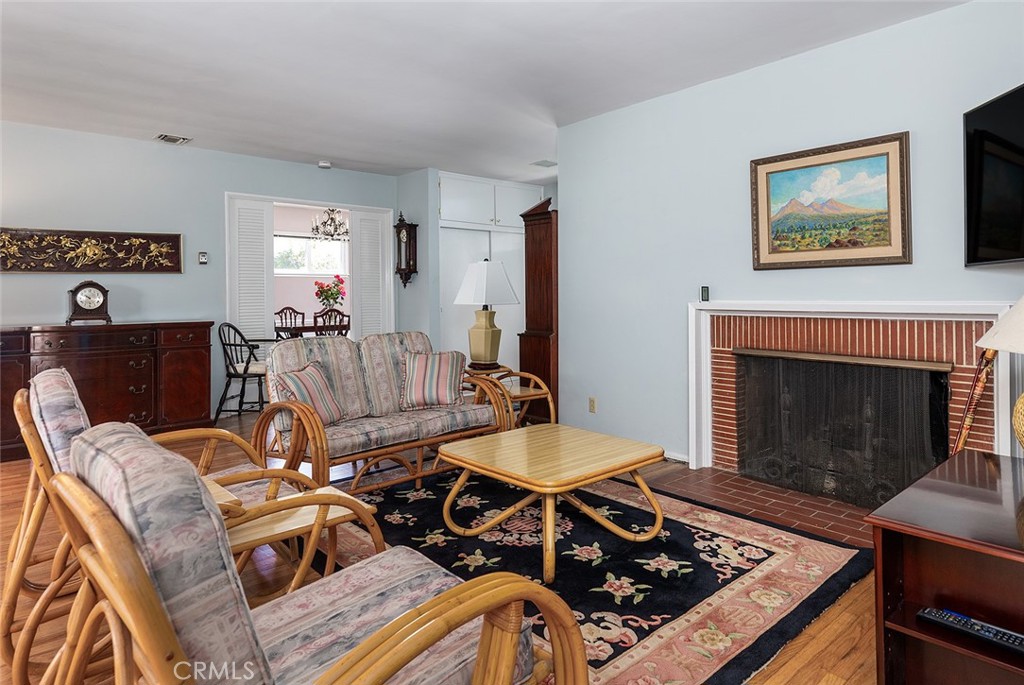 3280 Orlando Road Pasadena, CA 91107 - Photo 7 of 26 a living room with furniture and a fireplace