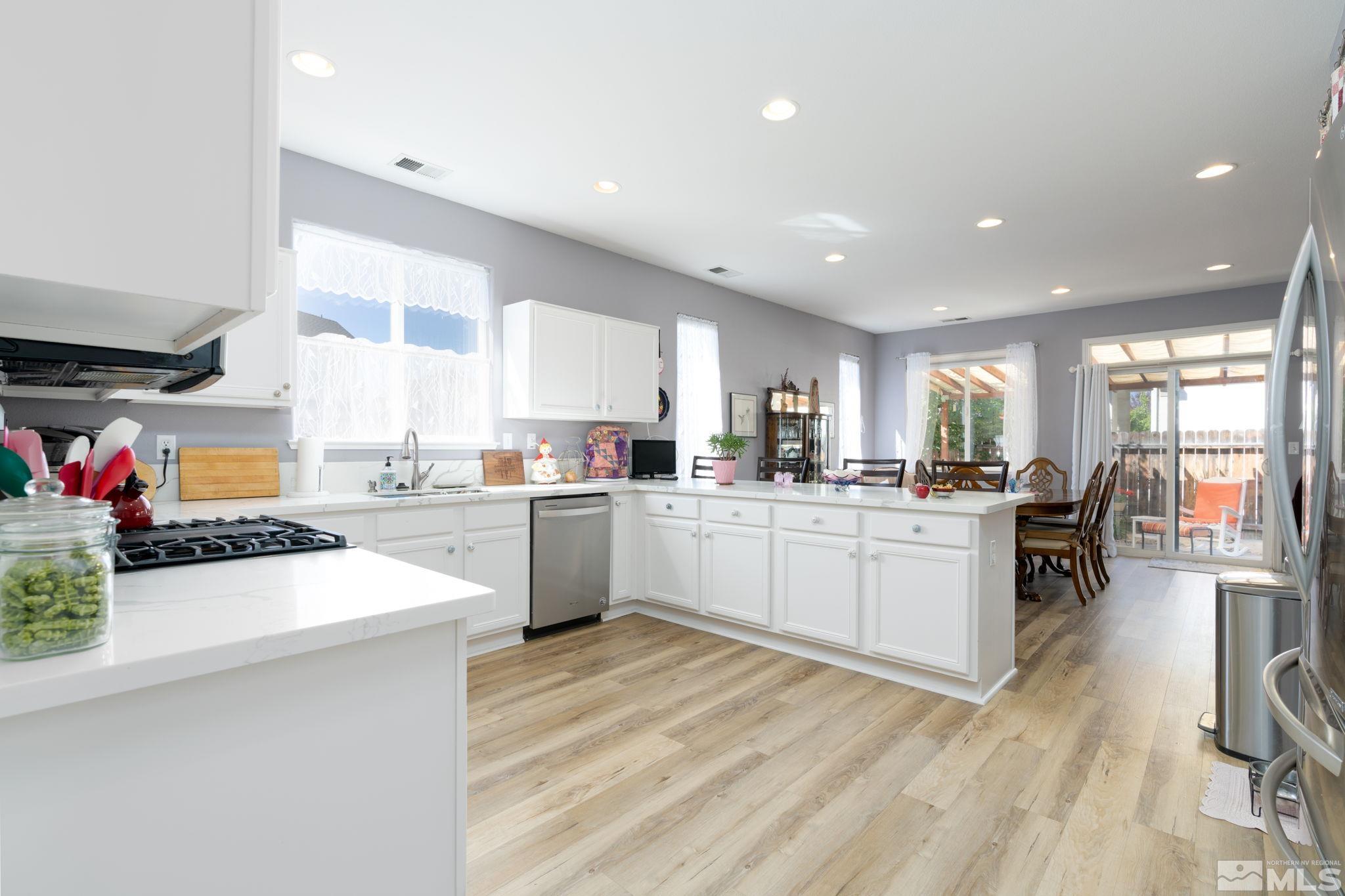 2272 Big Trail Circle Reno, NV 89521 - Photo 3 of 21 a kitchen with a sink stainless steel appliances and cabinets