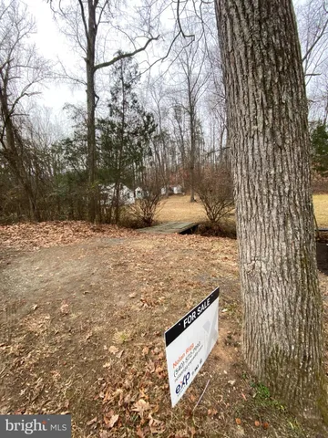 a view of outdoor space with wooden fence