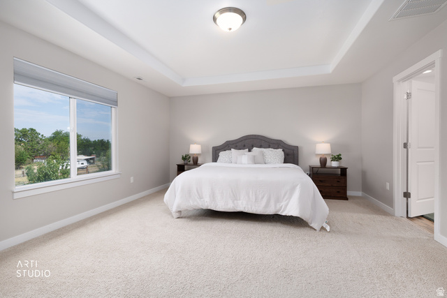 1654 South 730 West Provo, UT 84601 - Photo 19 of 33 Spacious room featuring a tray ceiling with recessed lighting, light-colored carpeting, and a large window