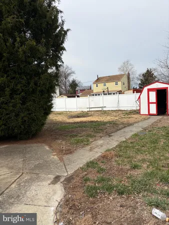 a view of a yard with cars