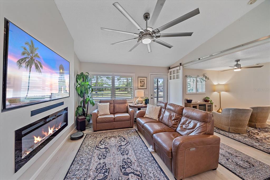 1488 Jupiter Road Venice, FL 34293 - Photo 7 of 21 a living room with furniture and a large window