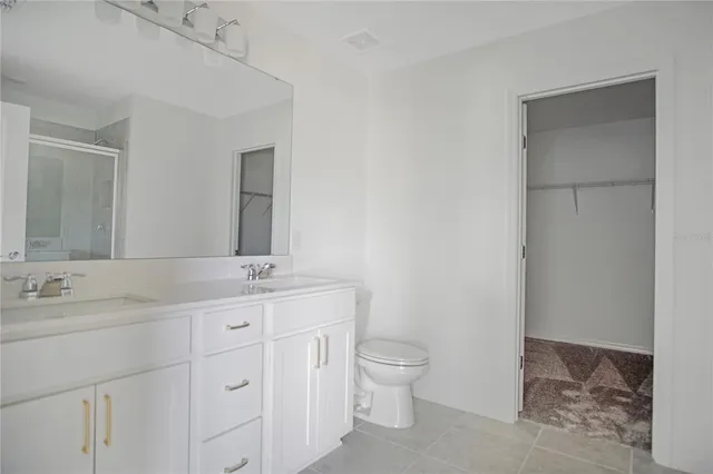 a bathroom with a shower and a sink