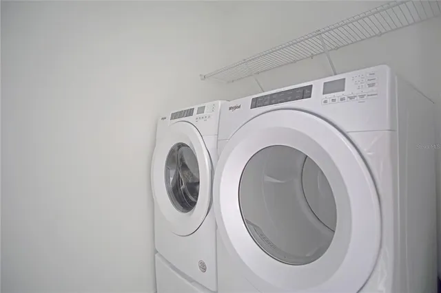 a view of a house with backyard and porch