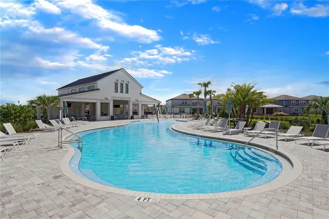 a room with furniture a large window and a chandelier