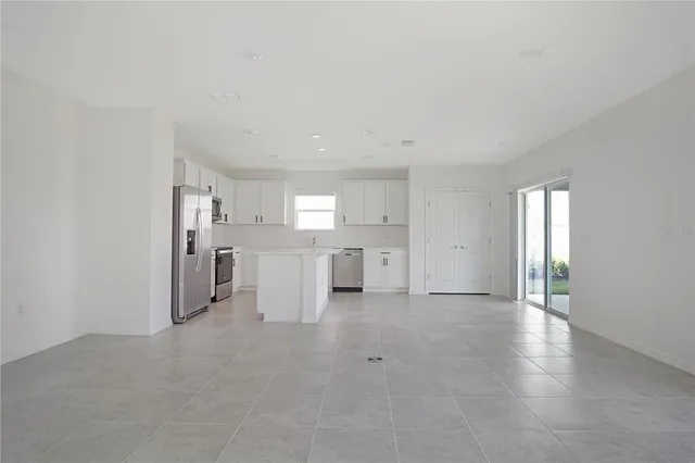 a view of a kitchen with a sink and a cabinet