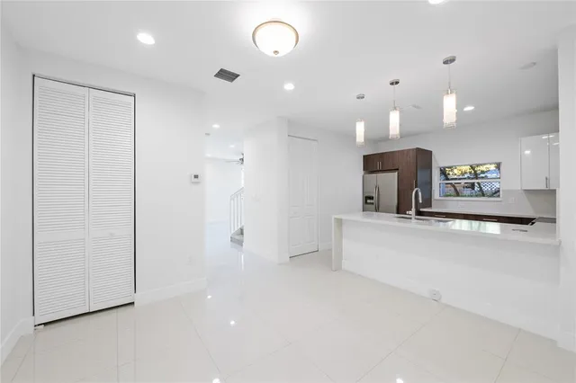 a view of living room with furniture and a flat screen tv