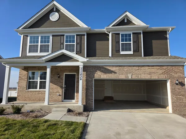 a front view of a house with a garage