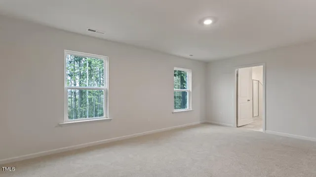 an empty room with windows