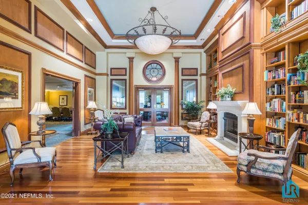 a view of a lake with boats and trees in the background