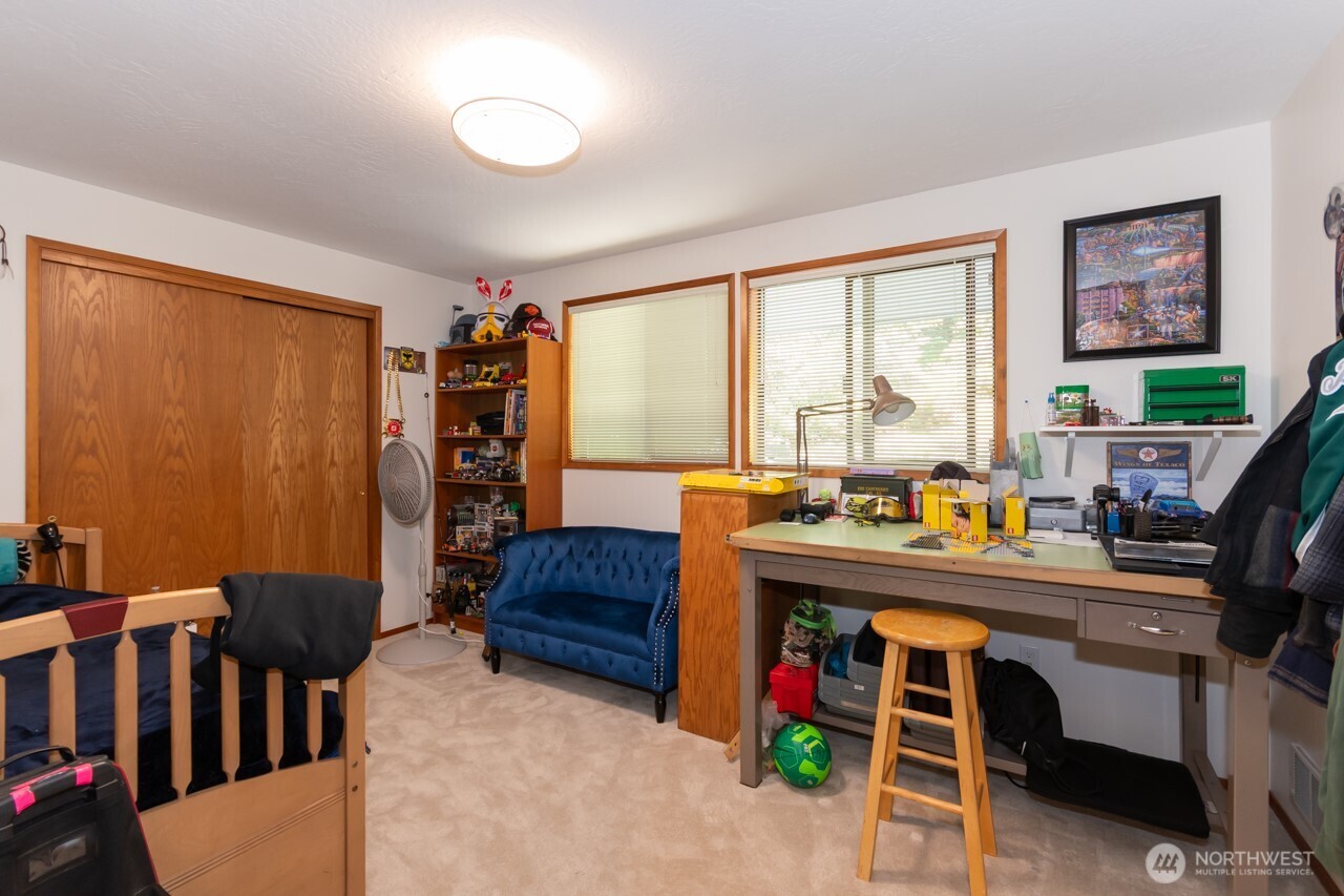 492 Walkabout Way Port Angeles, WA 98363 - Photo 28 of 40 a bed room with furniture and a window