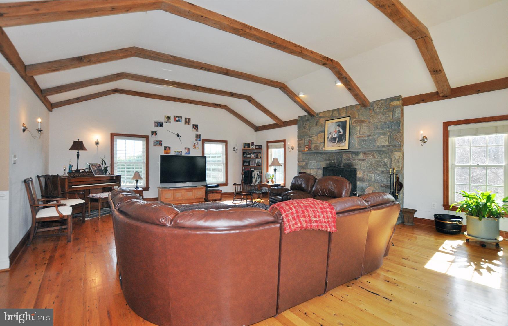 1342 Excaliber Lane Silver Spring, MD 20906 - Photo 14 of 33 Floor to ceiling raised hearth Stone fireplace.