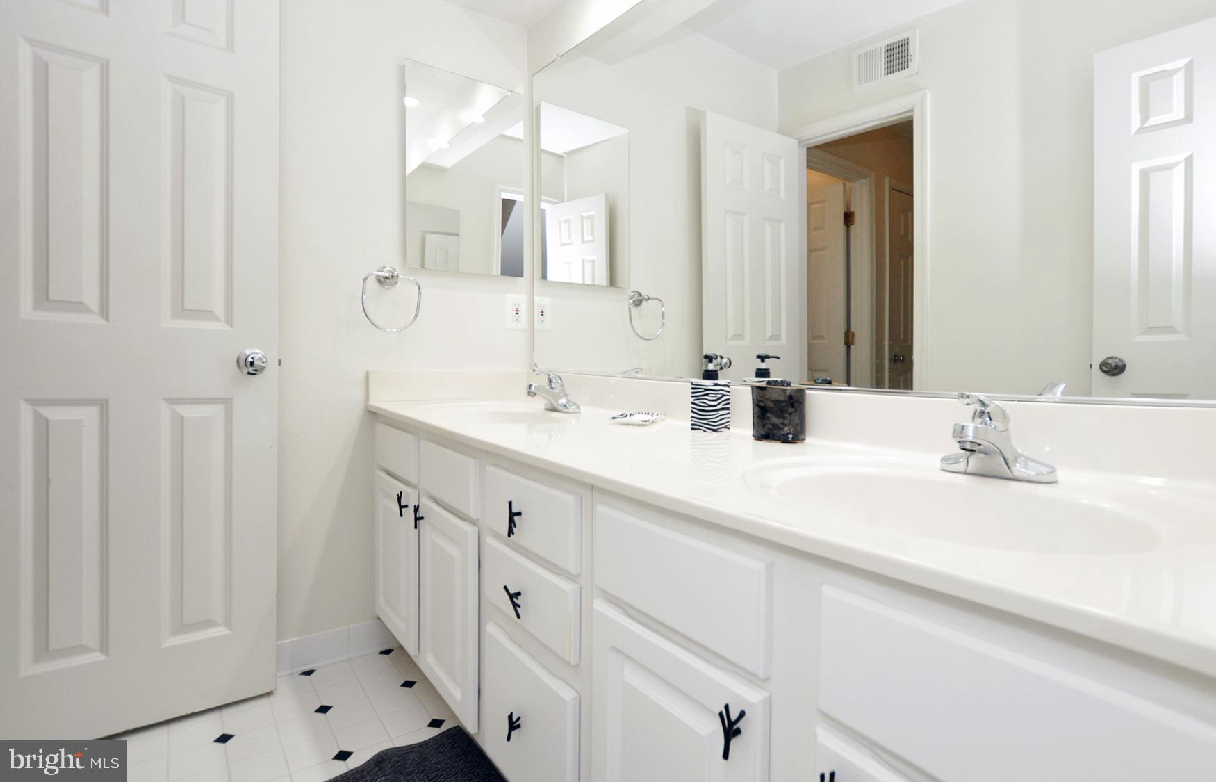 1342 Excaliber Lane Silver Spring, MD 20906 - Photo 25 of 33 Third full bath with custom ceramic tiling & tub.