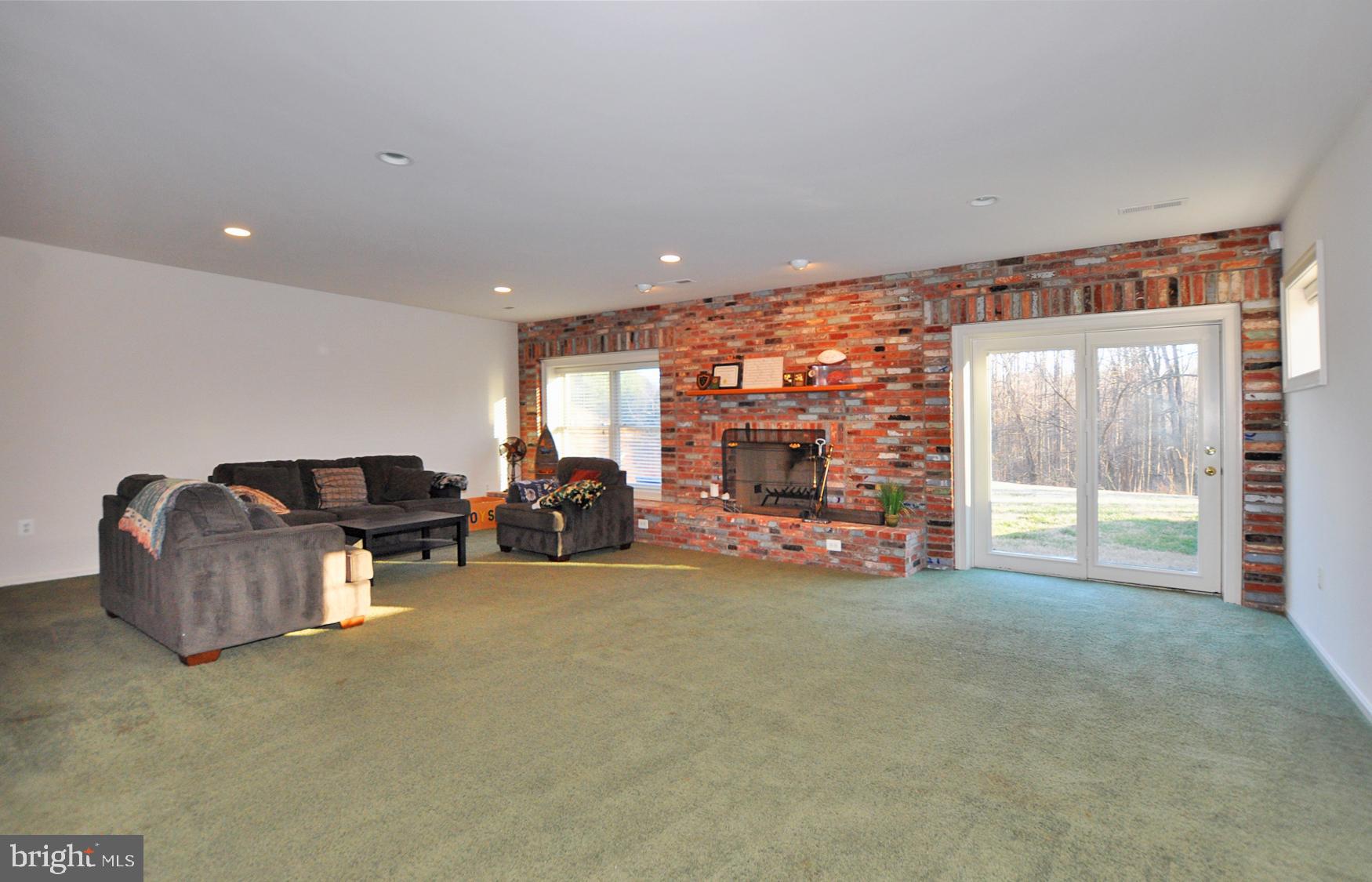 1342 Excaliber Lane Silver Spring, MD 20906 - Photo 26 of 33 Walk-out Recreation room w/Antique brick fireplace