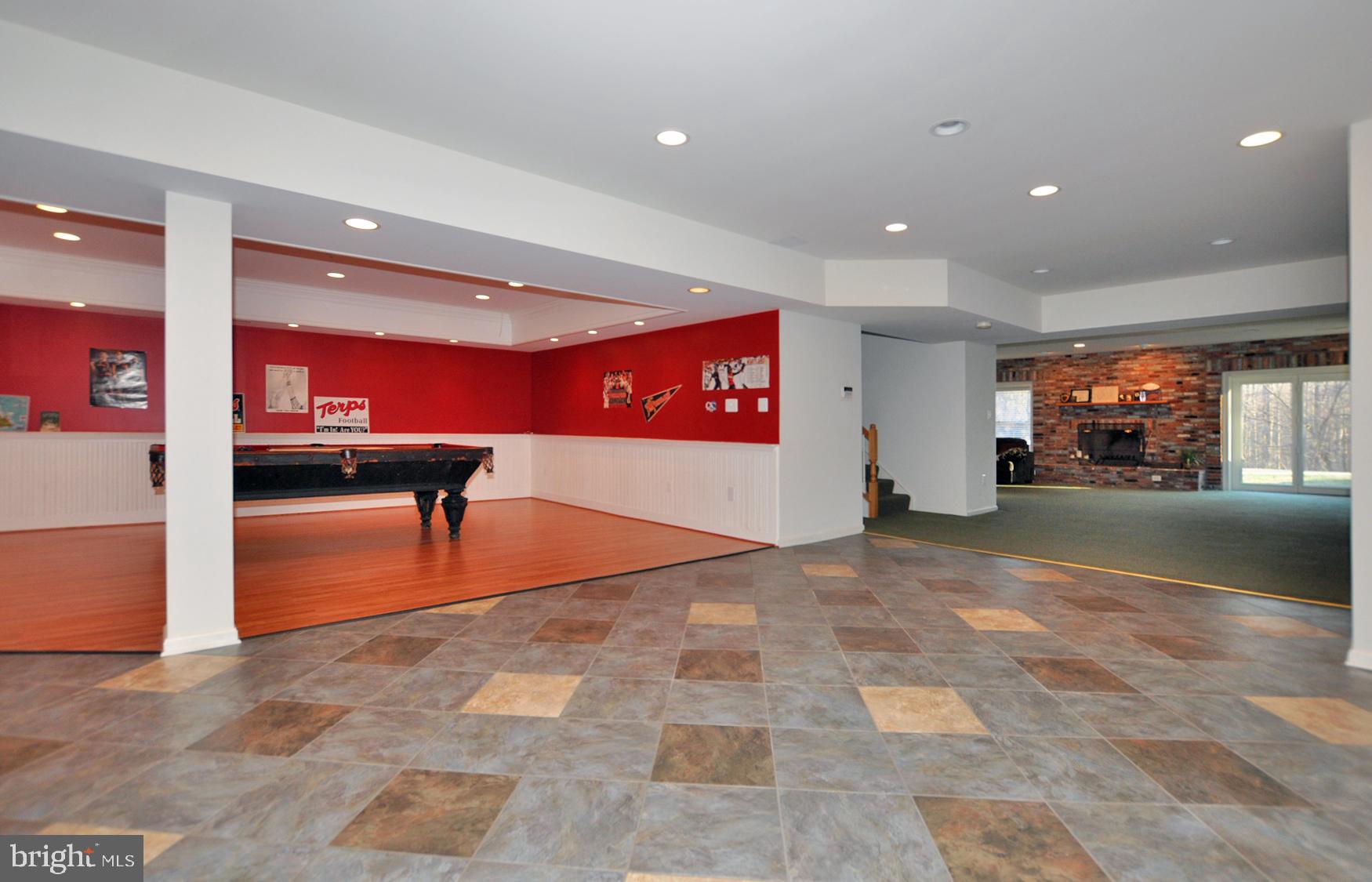 1342 Excaliber Lane Silver Spring, MD 20906 - Photo 27 of 33 Lower level Game room w/ Laminate flooring.