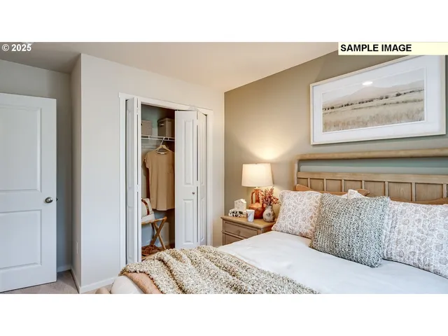 a living room with a bed and furniture