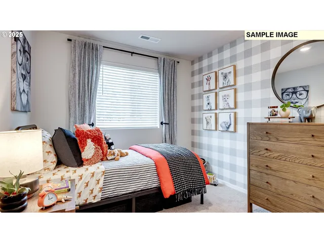 a bedroom with a bed and a dresser