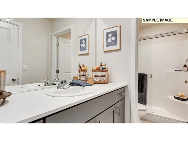 a bathroom with a sink vanity granite and a mirror