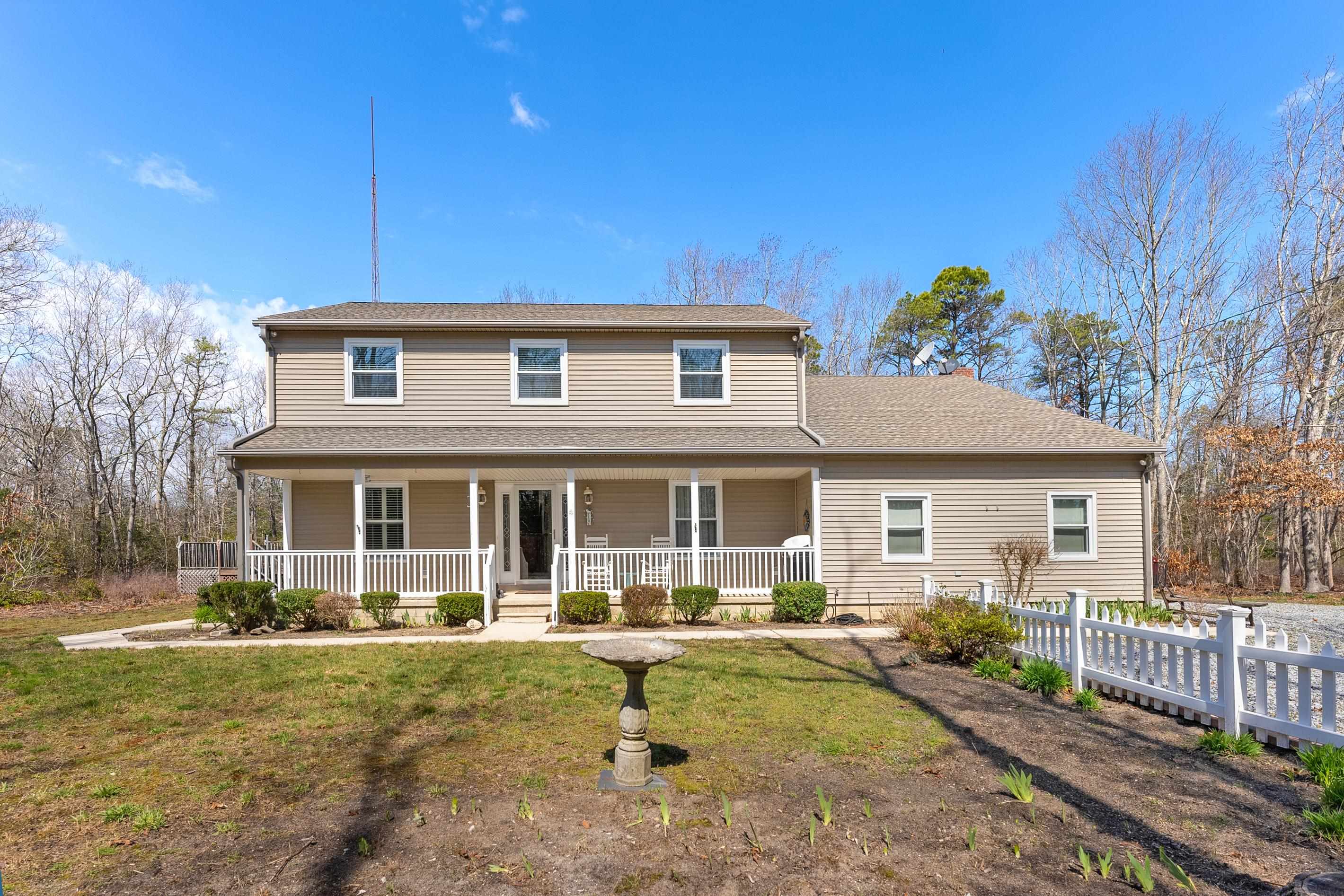 95 Peach Orchard Road Ocean View, NJ 08230 - Photo 1 of 41 a front view of a house with garden
