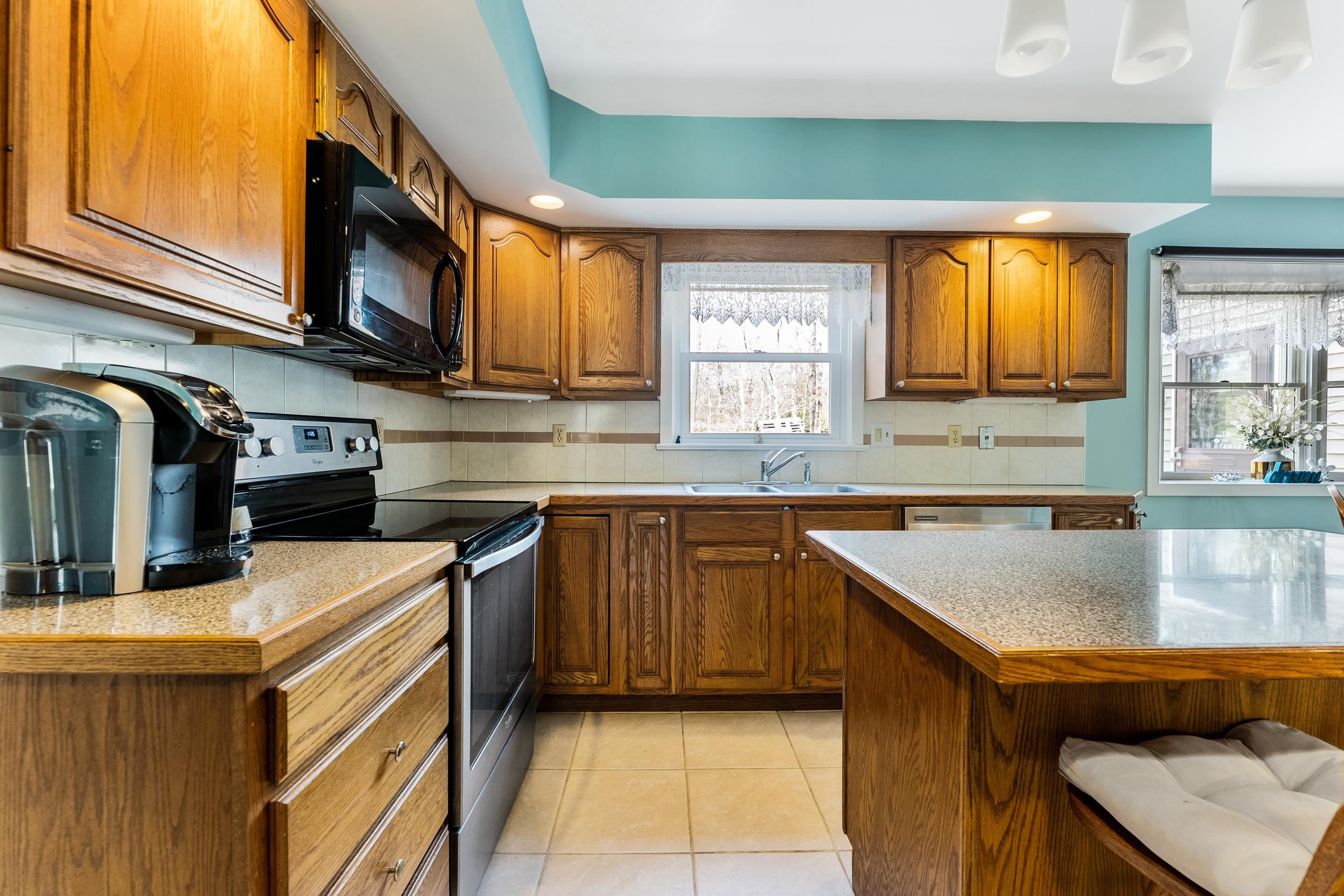 95 Peach Orchard Road Ocean View, NJ 08230 - Photo 11 of 41 a kitchen with stainless steel appliances granite countertop a sink a stove and cabinets
