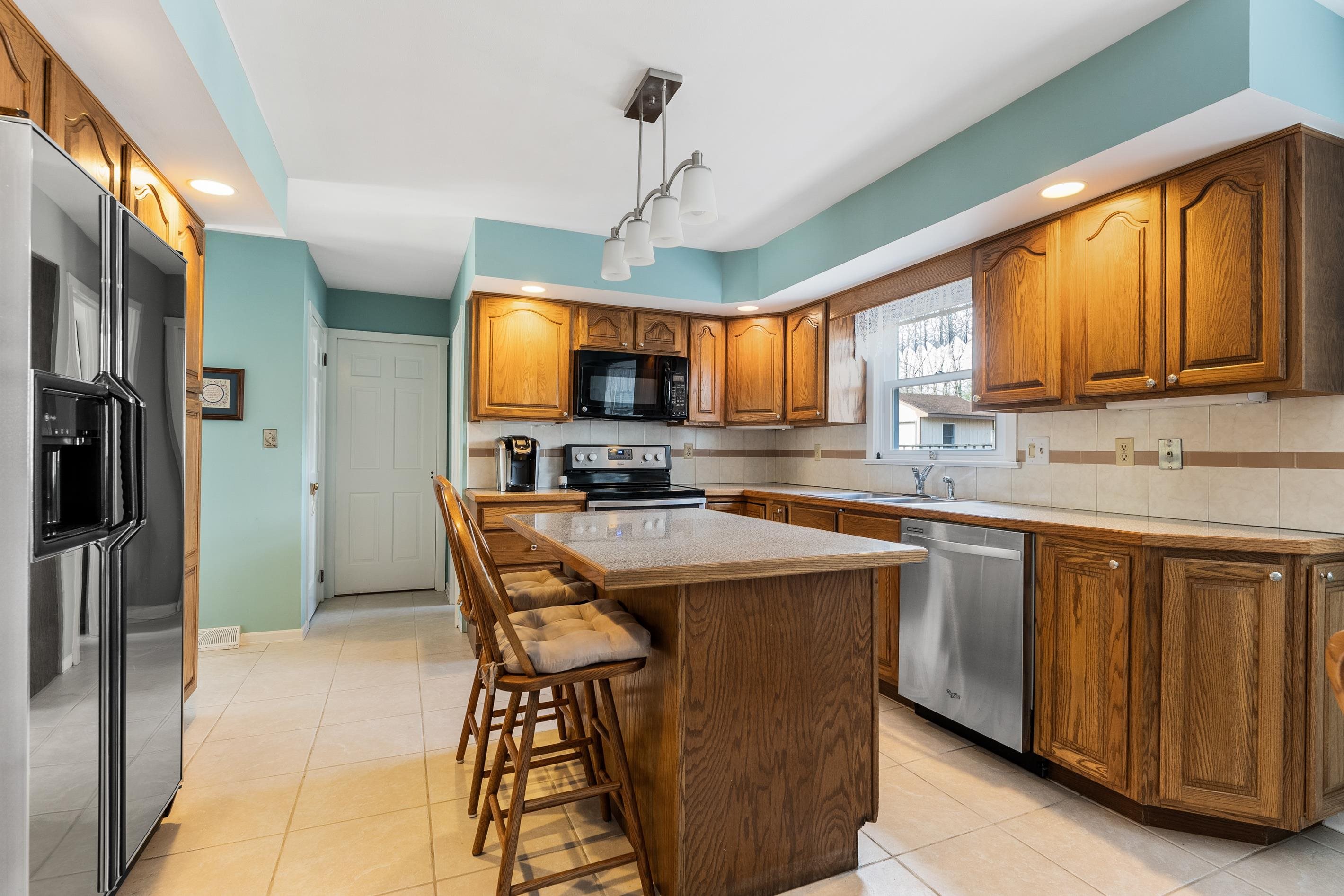 95 Peach Orchard Road Ocean View, NJ 08230 - Photo 12 of 41 a kitchen with stainless steel appliances granite countertop a stove a sink dishwasher a refrigerator and a microwave oven