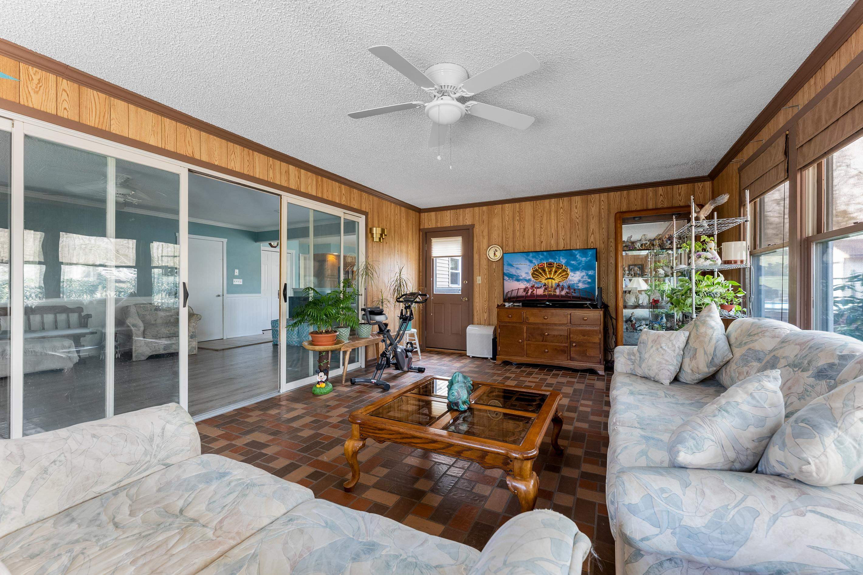 95 Peach Orchard Road Ocean View, NJ 08230 - Photo 18 of 41 a living room with furniture a flat screen tv and a large window